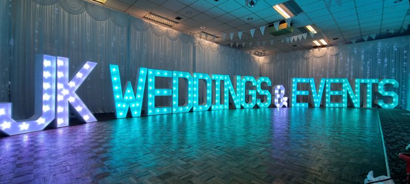 Illuminated letters spelling a company name