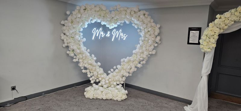 Village Hotel dudley with a white flower arch